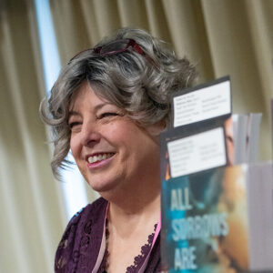 Kit McKenna Headshot with book